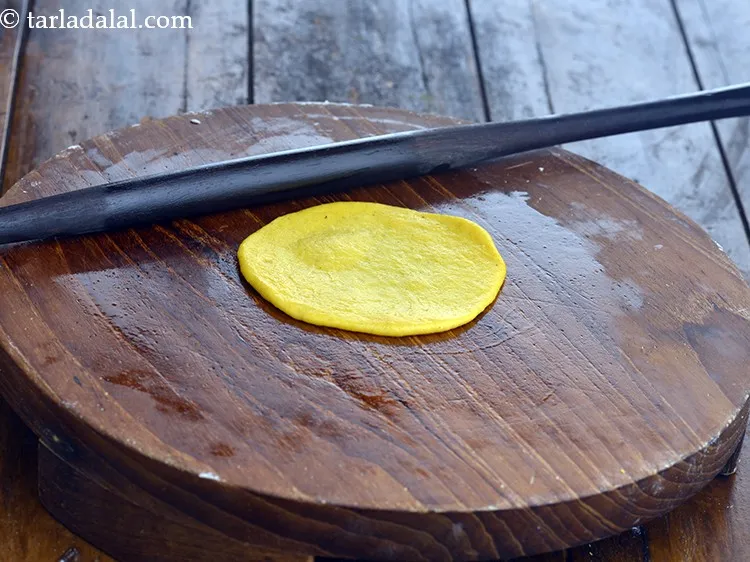 Step 5 – Instead of using maida for rolling, you can grease the rolling board with little oil …