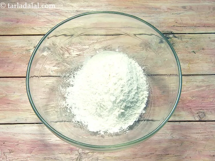 Step 13 – Add 3/4 cup&nbsp;<a href="https://www.tarladalal.com/glossary-plain-flour-maida-188i">plain flour (maida)</a> to it.&nbsp;