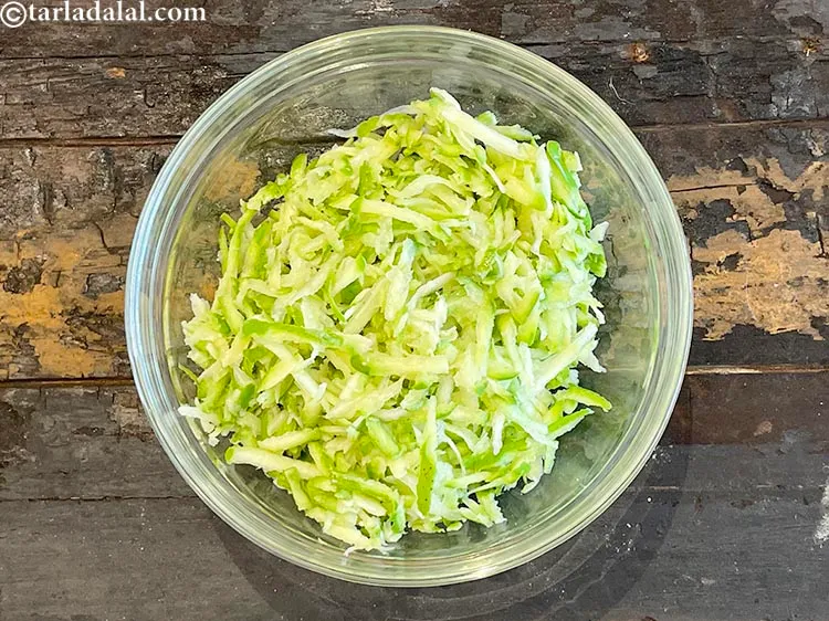 Step 6 – In a deep glass bowl put&nbsp;1 1/2 cups&nbsp;<a href="https://www.tarladalal.com/glossary-grated-raw-mango-2033i">grated raw mango</a>.
