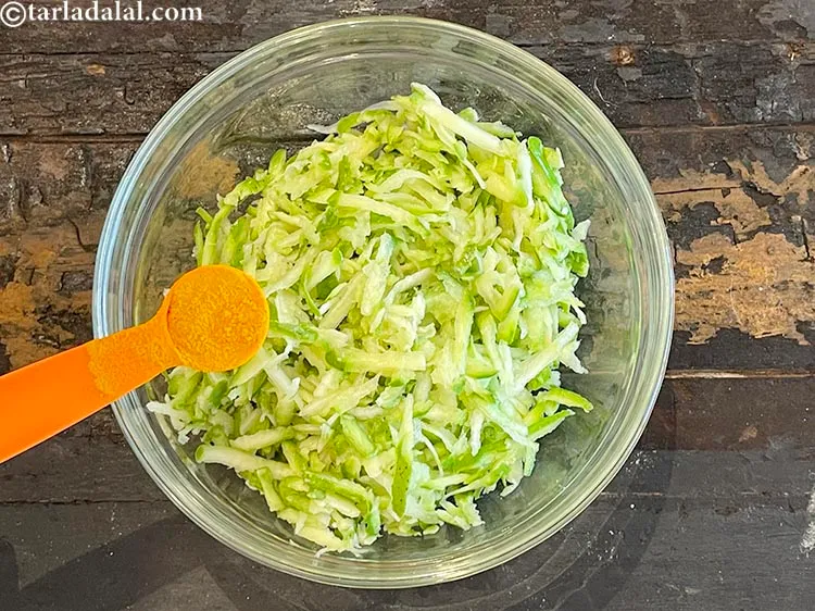 Step 7 – Add&nbsp;1 tsp&nbsp;<a href="https://www.tarladalal.com/glossary-turmeric-powder-haldi-645i">turmeric powder (haldi)</a>.