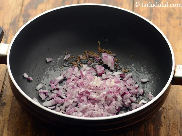 Step 11 – When the seeds crackle, add onions. For Maharashtrian weddings, this Masale Bhat is made without …