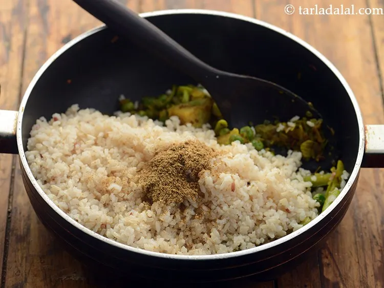 Step 25 – Add the prepared spice powder of <strong>healthy masala vegetable pulao</strong>. Add the prepared dry spice …