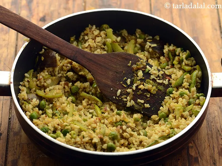 Step 26 – Mix well and cook <strong>healthy masala brown rice </strong>on a medium flame for 2 minutes, …