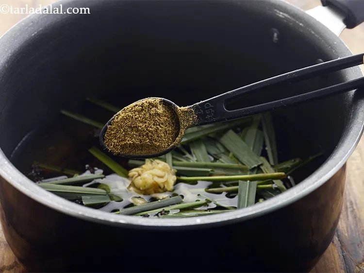 Step 12 – To make&nbsp;<strong>masala chai recipe</strong>, combine 2 cups of water, tea powder, sugar, lemongrass, ginger and …