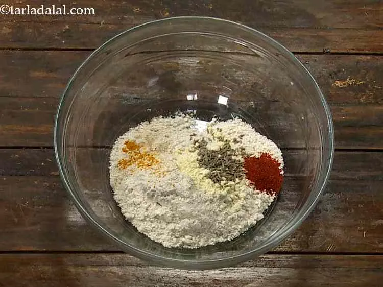 Step 4 – Add the chilli powder, turmeric powder and hing. Since this is a Masala Khakhra, we …
