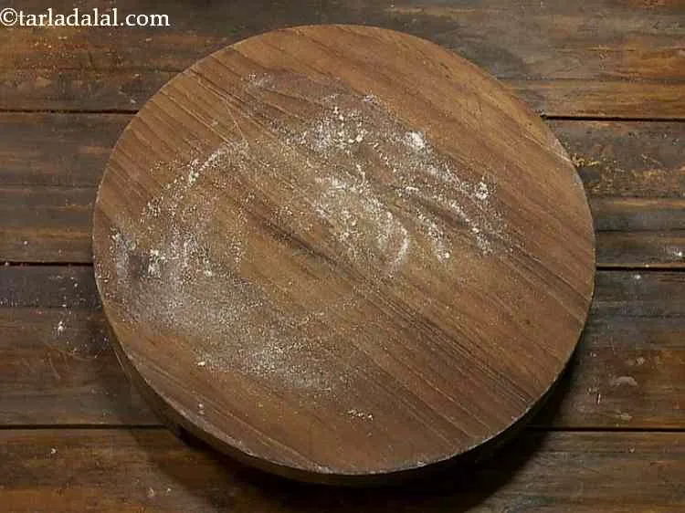 Step 10 – Sprinkle a little whole wheat flour on the rolling board.