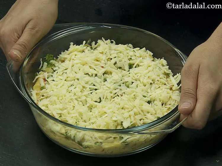 Step 16 – Sprinkle the remaining ? cup of cheese over it evenly. This will give an even …