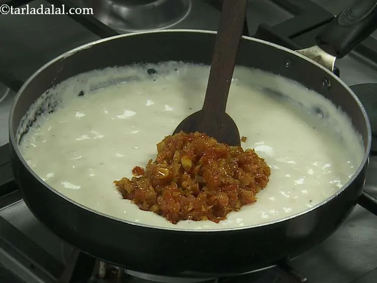 Step 12 – Once the cheese is incorporated completely, add the masala mixture to the sauce. This is …