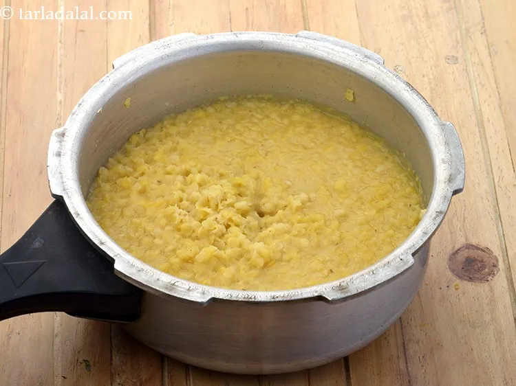 Step 11 – Mix well and pressure cook for 2 whistles. This is how to dal looks after …