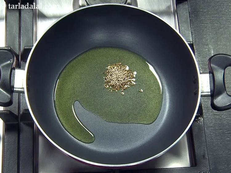 Step 13 – Add 1 tsp&nbsp;<a href="https://www.tarladalal.com/glossary-cumin-seeds-jeera-zeera-381i">cumin seeds (jeera)</a>.&nbsp;