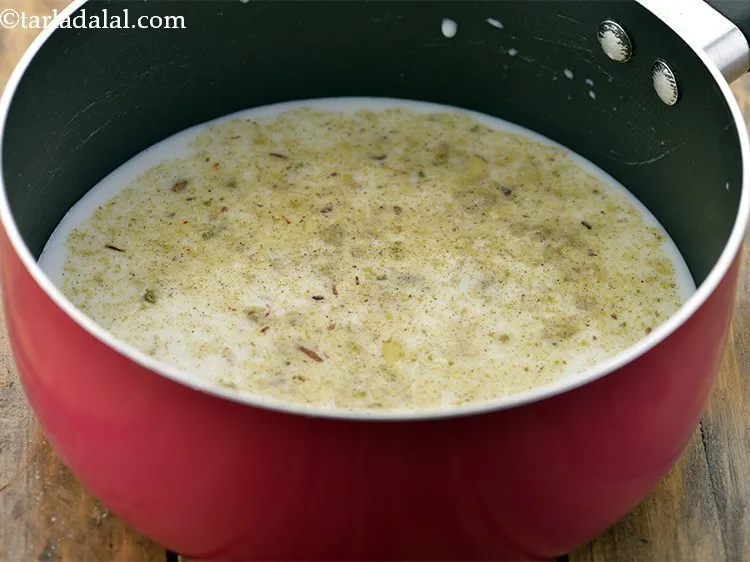 Step 16 – Add 3 tbsp of <strong>Masala Milk Powder</strong> to the milk.