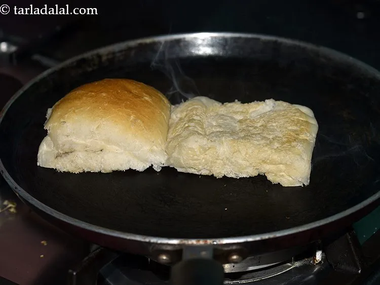 Step 21 – Heat a non-stick tava ( griddle) and place the ladi pav inverted on the tawa …