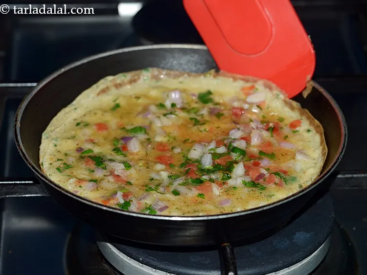 Step 14 – Cook on a medium flame for 2 minutes till the omelette sets and turns light …