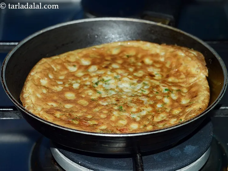 Step 16 – When the base firms up, turn over the omelette carefully and cook masala omelette on …