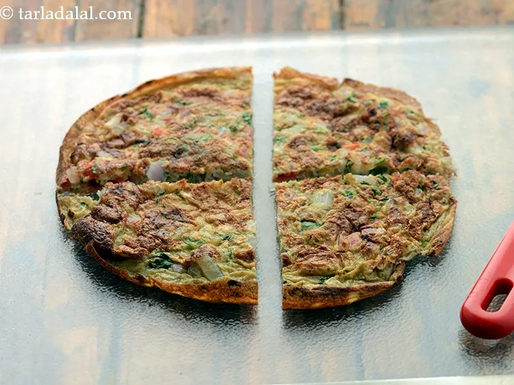 Step 26 – Cut an omelette into 4 equal portions.&nbsp;