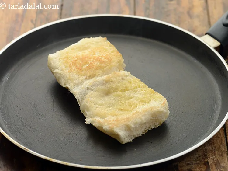 Step 22 – Flip the ladi pav and cook on the outside till it turns golden brown in …