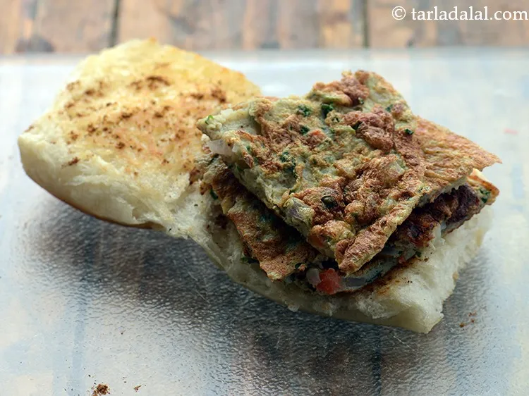 Step 27 – Place the 4 pieces of the omelette over the lower halve of the ladi pav …