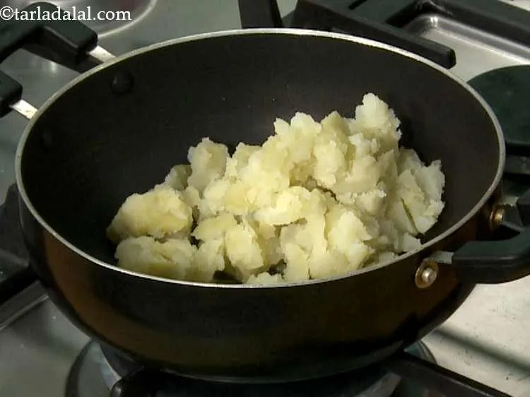 Step 9 – Add the boiled potatoes. Learn <a href="/How-To-Boil-Potatoes-in-A-Microwave-22482r">how to boil potatoes in a microwave</a> in just …