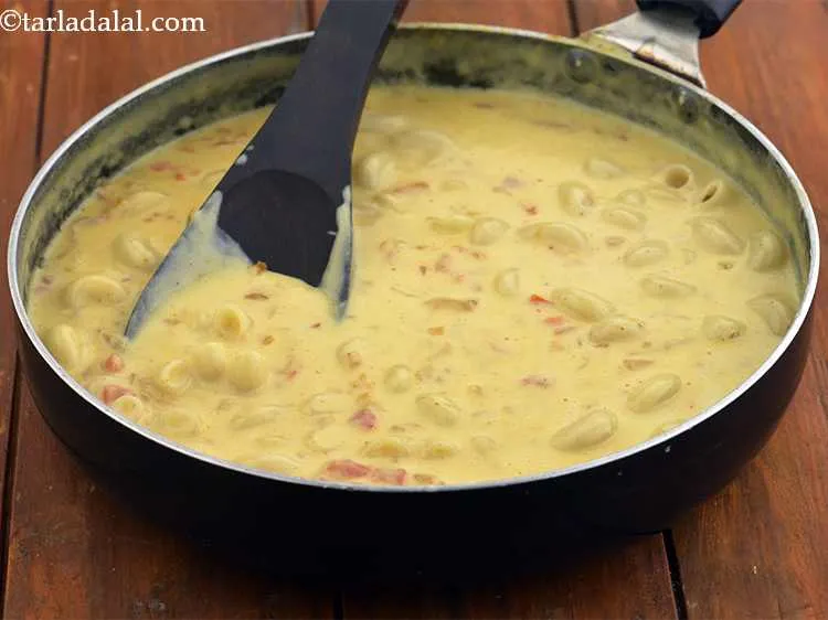 Step 13 – Also add the boiled macaroni, mix well and cook on a medium flame for 2 …