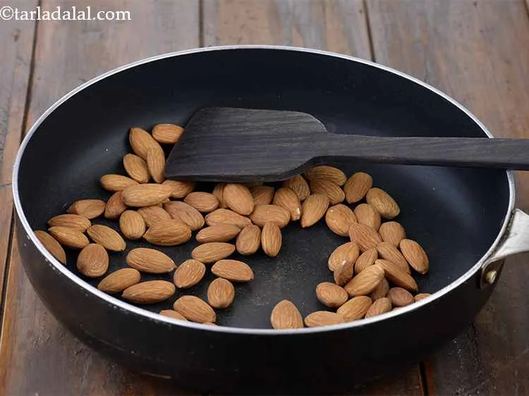 Step 2 – In the same broad non-stick pan, add the almonds (badam) and dry roast on a …