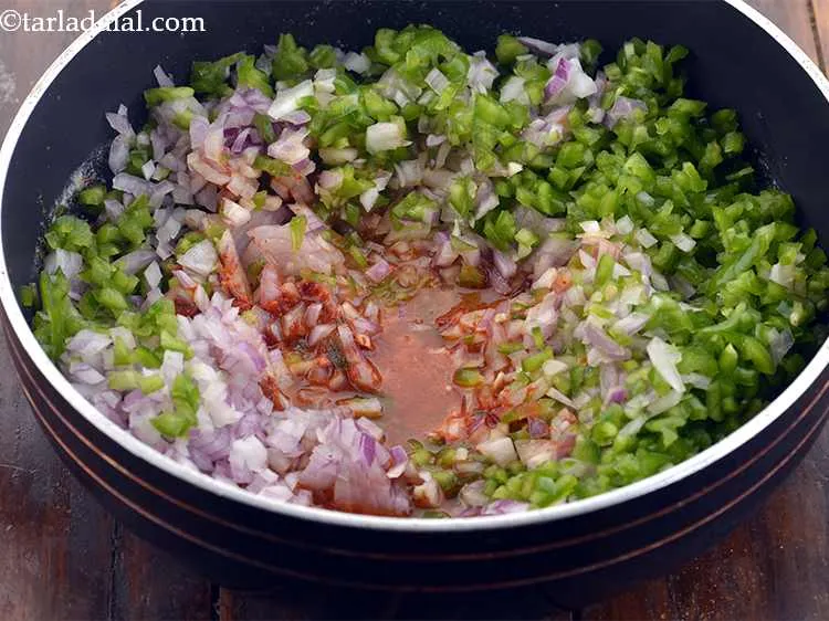 Step 12 – Add around &frac14; cup of water and mix well. The masala should neither be dry …