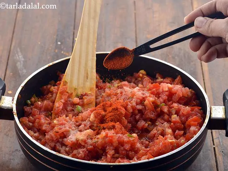 Step 15 – Add the chilli powder. Spicy food lovers can toss in some more chilli powder.