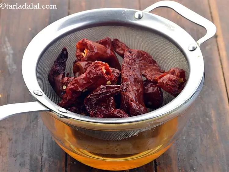 Step 13 – Drain the chillies.