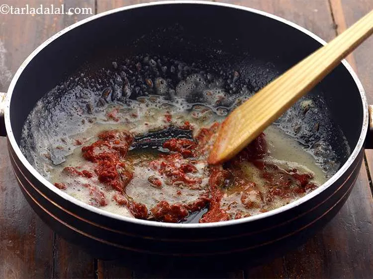 Step 9 – When the seeds crackle, add 4 tbsp of the prepared red chilli-garlic paste and saut&eacute; …