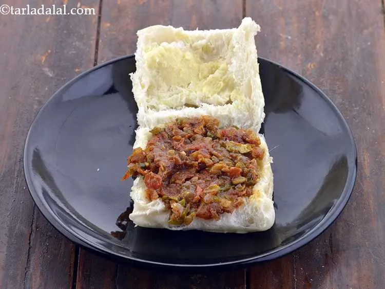 Step 17 – Put a portion of the masala on one halve and close it.