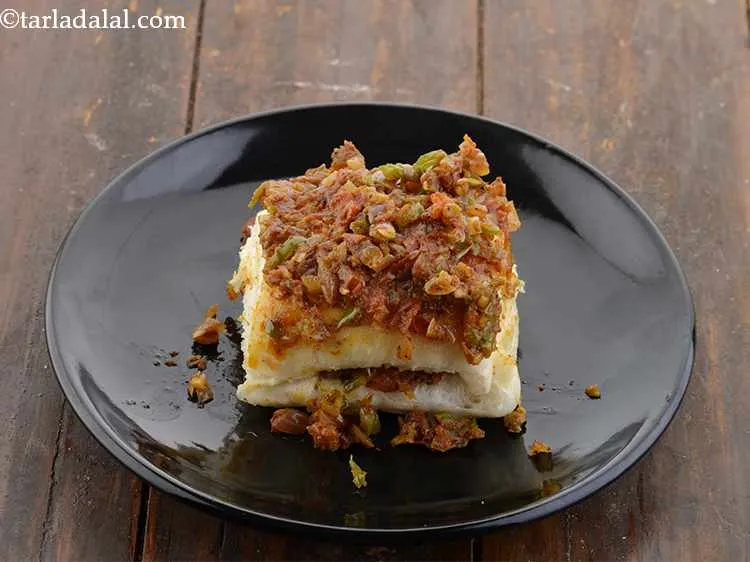 Step 18 – Put 1 more portion of the masala evenly over the pav till it gets evenly …