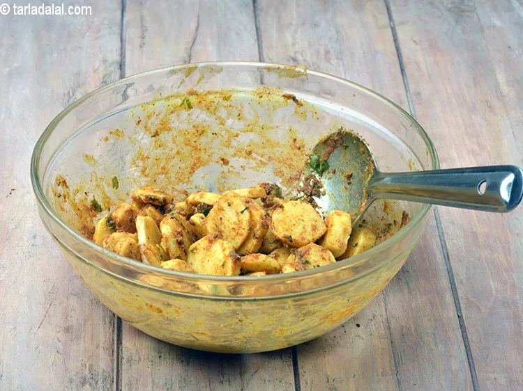 Step 42 – Add the prepared masala, colocassia, milk, cream and salt, mix gently and microwave on high …