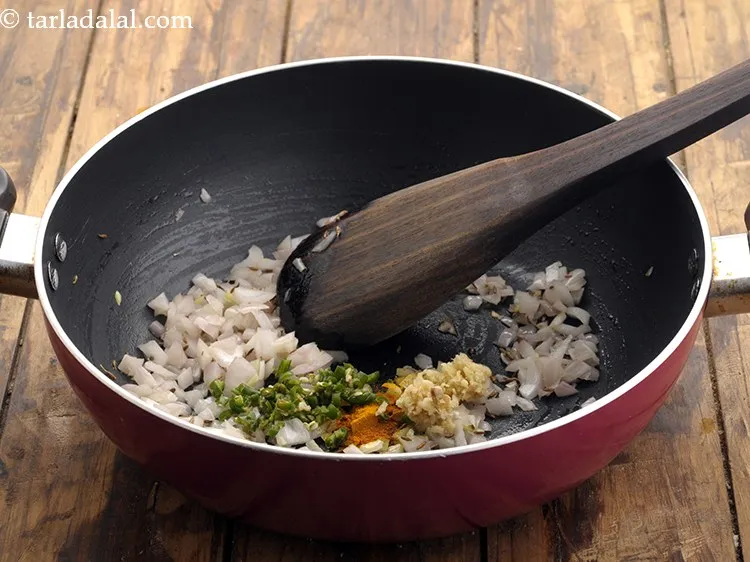 Step 12 – Add <a href="https://www.tarladalal.com/Ginger-Green-Chilli-Paste-33529r" target="_blank">ginger and green chillies</a>. You can even make use of.