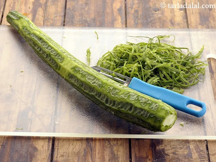 Step 3 – Lightly scrape, peel the skin and discard it.