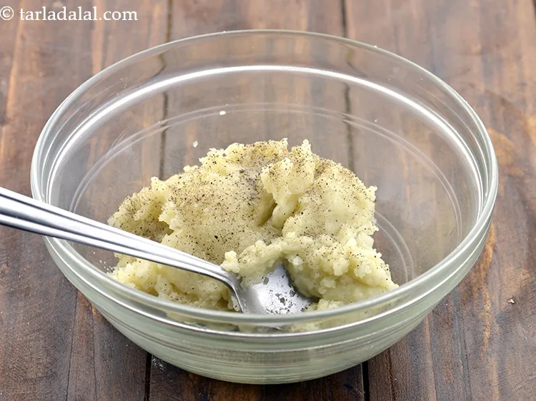 Step 21 – Add <a href="https://www.tarladalal.com/glossary-freshly-ground-black-pepper-kalimirch-powder-kali-mirch-ka-powder-567i">freshly ground black pepper (kalimirch)</a>&nbsp;to taste.&nbsp;