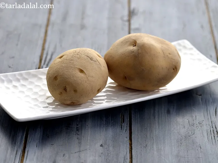 Step 13 – To cook potatoes, place 4&nbsp;medium boiled and peeled&nbsp;<a href="https://www.tarladalal.com/glossary-potatoes-aloo-alu-batata-710i">potatoes</a>, with the skin, on the microwave …