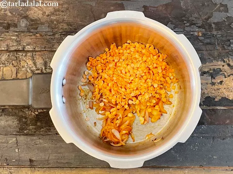 Step 13 – Add&nbsp;<meta charset="UTF-8" />1/4 cup&nbsp;<a href="glossary-masoor-dal-split-red-lentil-masoor-ki-dal-303i">masoor (split red lentil) dal</a>&nbsp;, washed and drained.