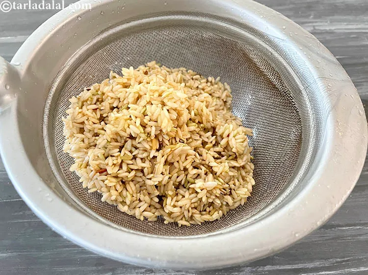Step 12 – Drain the brown rice.
