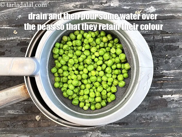 Step 7 – Drain and pour some water over the peas. This heps retain the colour of matar.