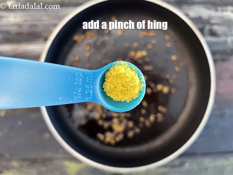 Step 16 – <meta charset="UTF-8" />Add a few pinches&nbsp;<a href="glossary-asafoetida-hing-113i">asafoetida (hing)</a>.
