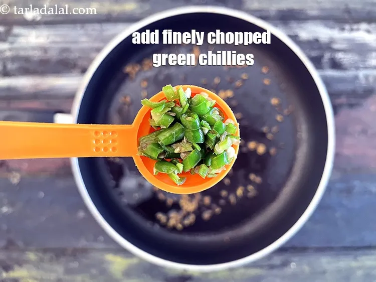 Step 17 – Add 1 tsp&nbsp;finely chopped&nbsp;<a href="glossary-green-chillies-hari-mirch-331i">green chillies</a>.