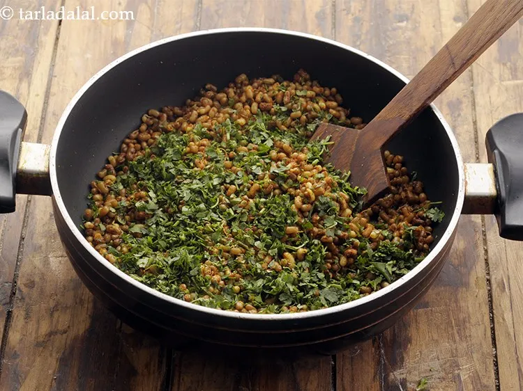 Step 32 – Add coriander for a flavourful touch. Mix well.&nbsp;