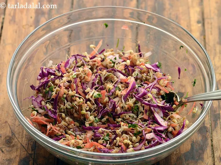 Step 33 – Toss all the ingredients of easy sprouts salad very well using a big spoon.