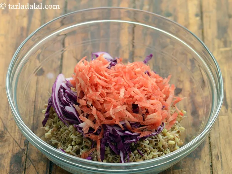 Step 26 – Add grated carrot. Since it is a salad, thickly grated carrots have been used.