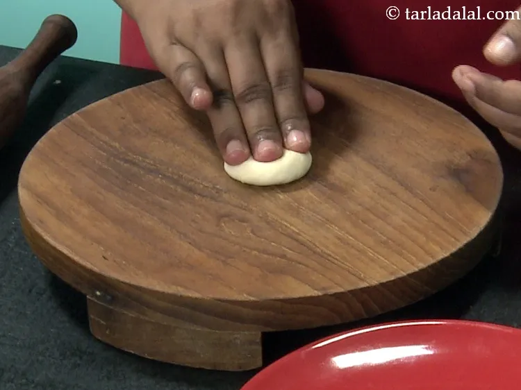 Step 38 – Place it on a rolling board and flatten it.&nbsp;