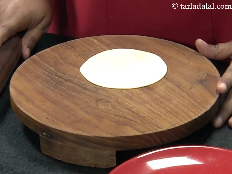 Step 39 – Roll out a portion of the dough into a 175 mm. (3&quot;) diameter circle without …