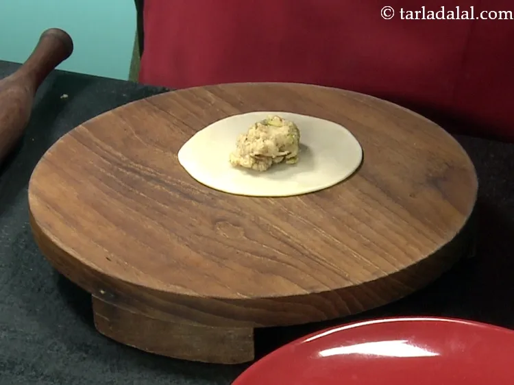 Step 40 – Place a portion of the stuffing in the centre.