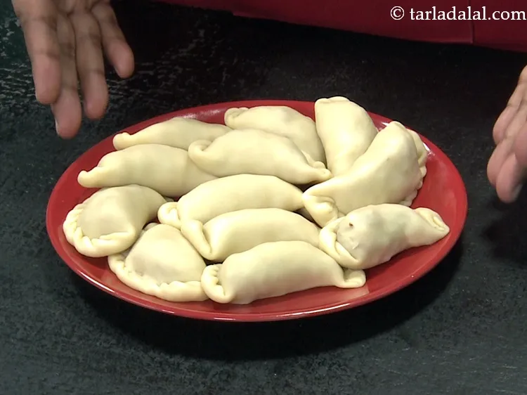 Step 44 – Repeat steps 2 to 8 to make 11 more karanjis.