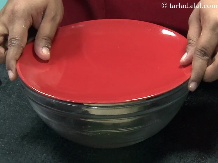 Step 26 – Cover the dough with a lid and keep aside for 10 minutes.