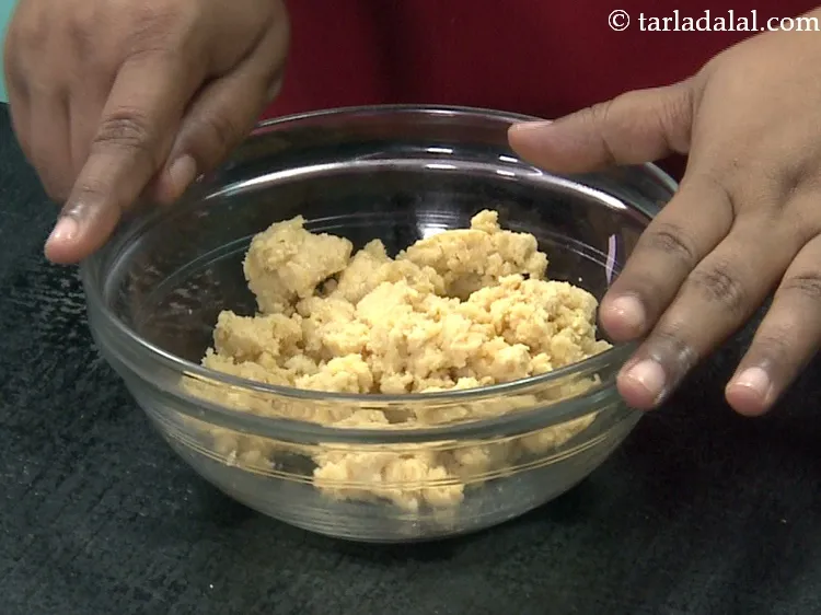 Step 27 – For the stuffing of <strong>mawa karanji</strong>, add 1 cup&nbsp;<a href="https://www.tarladalal.com/glossary-crumbled-mawa-2259i">crumbled mawa (khoya)</a> in a deep …