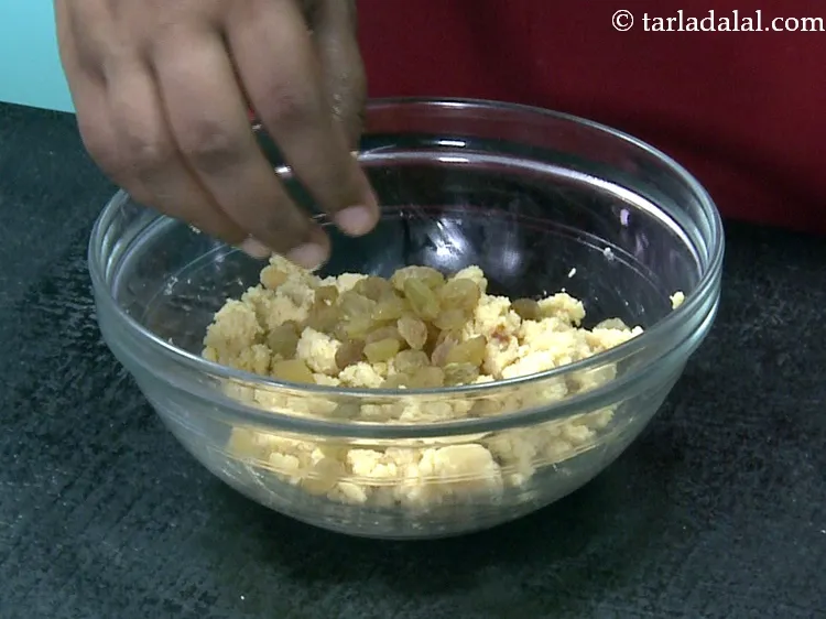 Step 28 – Add 2 tbsp&nbsp;<a href="https://www.tarladalal.com/glossary-raisins-kishmish-kismis-597i">raisins (kismis)</a>.